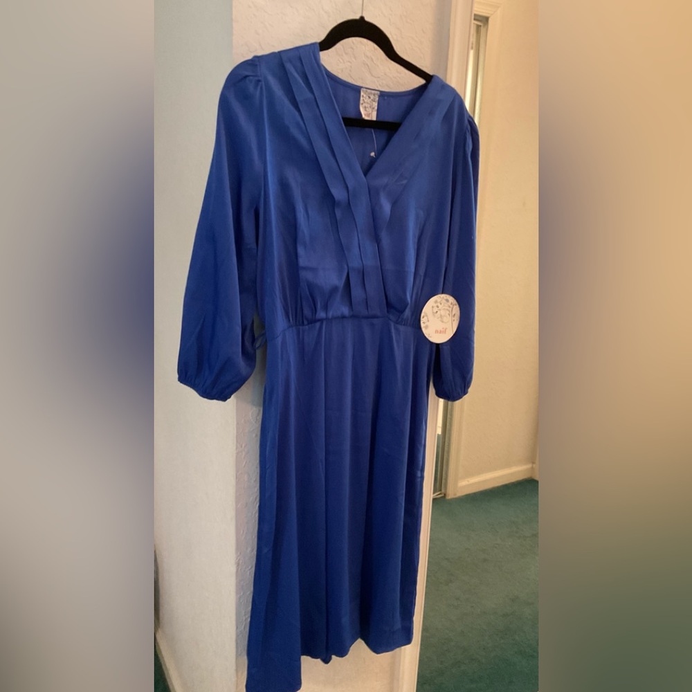 Blue Dres size medium.  Brand new with tags.